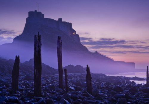 A CONDITION OF USING THESE IMAGES IS THAT THE BOOK IN WHICH THE IMAGES APPEAR MUST BE MENTIONED IN THE ARTICLE. IT IS A NECESSITY THAT THE BOOK COVER IS ALSO FEATURED.
 Mandatory Credit: Photo by Gary Waidson / Rex Features (1970580t)
 Lindisfarne, Northumberland, England
 Landscape Photographer of the Year Book, Britain - Dec 2012
 A stunning new book shows the best of British landscapes.  'Landscape Photographer Of The Year: Collection 6,' offers a magical tour around the British Isles through the viewfinders of some of the best landscape photographers in the world.  The brainchild of Charlie Waite, one of today's most respected landscape photographers, the book showcases the best pictures from amateur and professional photographers alike from the sixth annual Landscape Photographer of the Year competition.  Highlights range from atmospheric urban views, including Ion Paciu's 'Sunset from a rooftop' which captures London at dusk, to inspiring views of lush countryside such as Andrew Wheatley's The Punch Bowl, Somerset.  'Landscape Photographer Of The Year: Collection 6' is published by AA Publishing and is out now.  A CONDITION OF USING THESE IMAGES IS THAT THE BOOK IN WHICH THE IMAGES APPEAR MUST BE MENTIONED IN THE ARTICLE. IT IS A NECESSITY THAT THE BOOK COVER IS ALSO FEATURED.